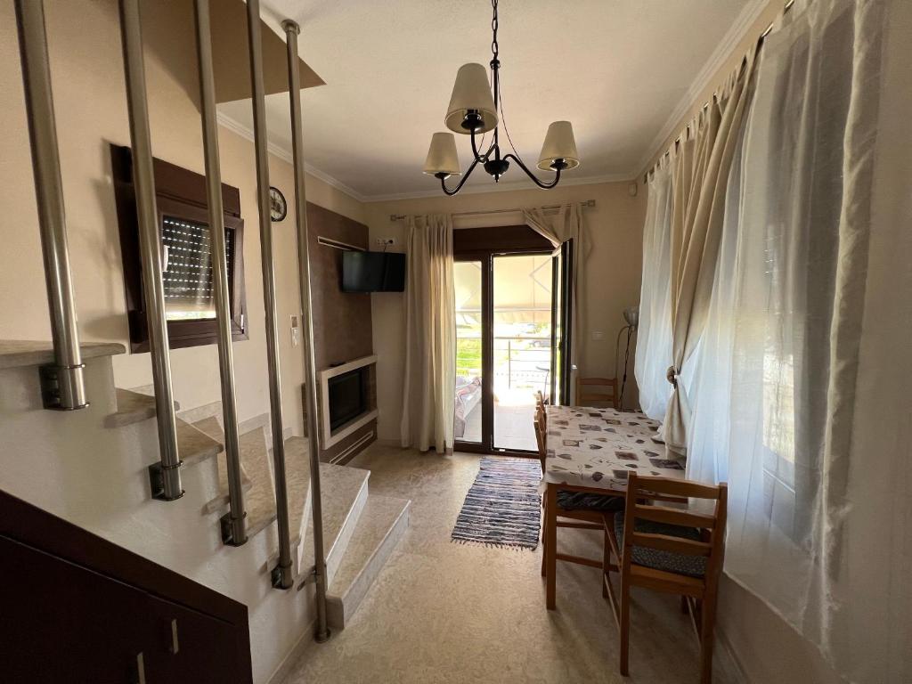 Televízia a/alebo spoločenská miestnosť v ubytovaní AM Beach House