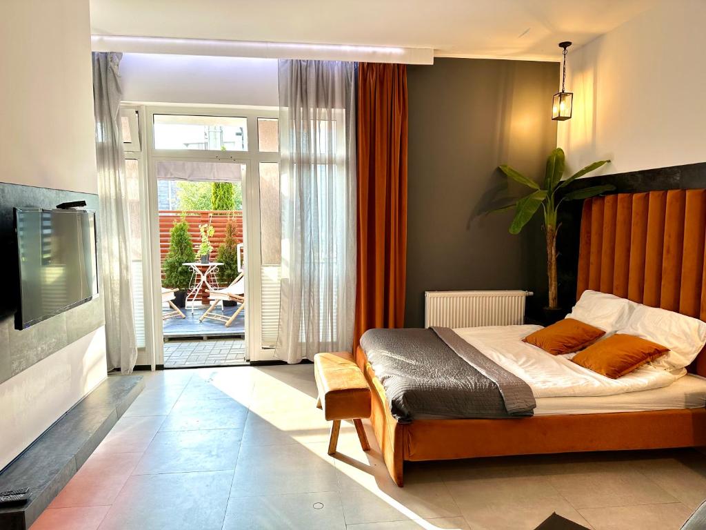 Ένα ή περισσότερα κρεβάτια σε δωμάτιο στο Sunset Apartments Kropla Baltyku