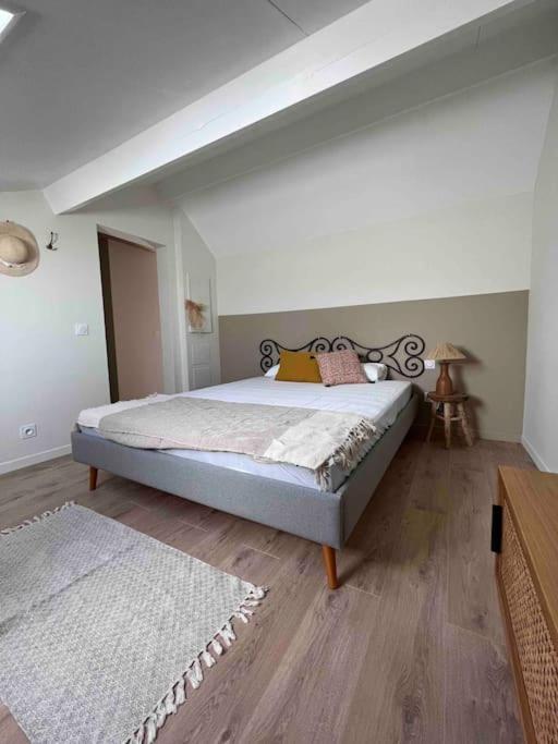 a bedroom with a large bed in a room at Casa Mariuccia in Algajola