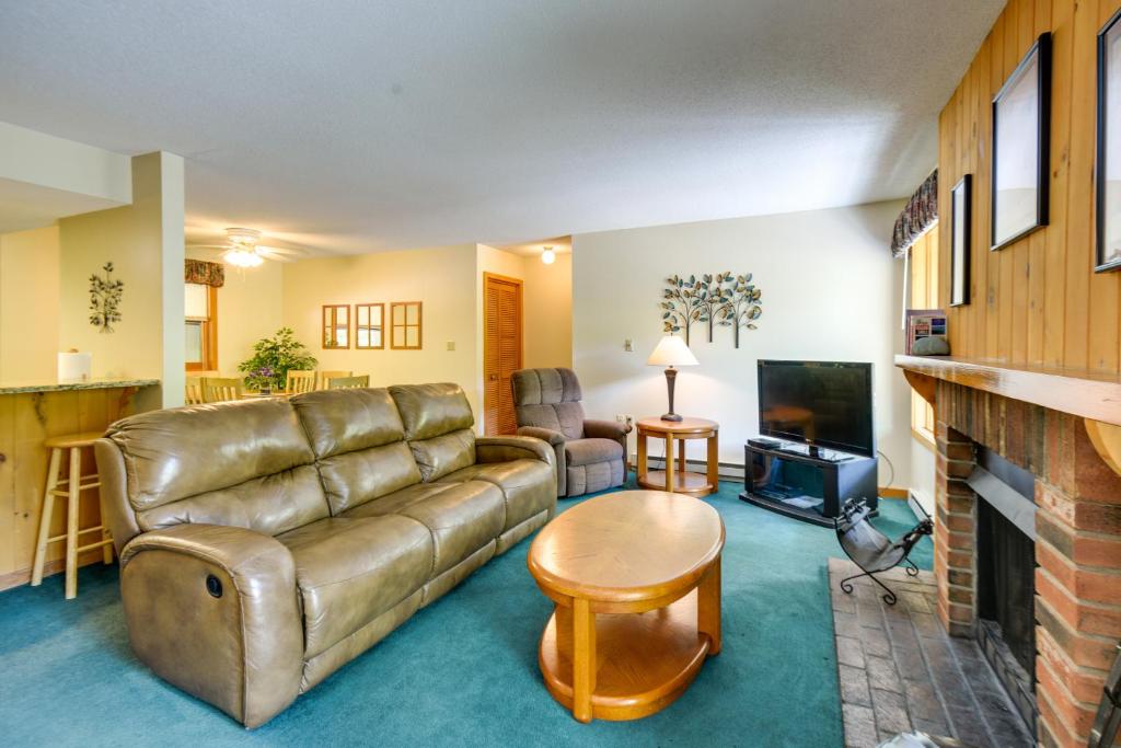 a living room with a couch and a fireplace at Well-Appointed Lincoln Abode Ski, Swim and Fish! in Lincoln