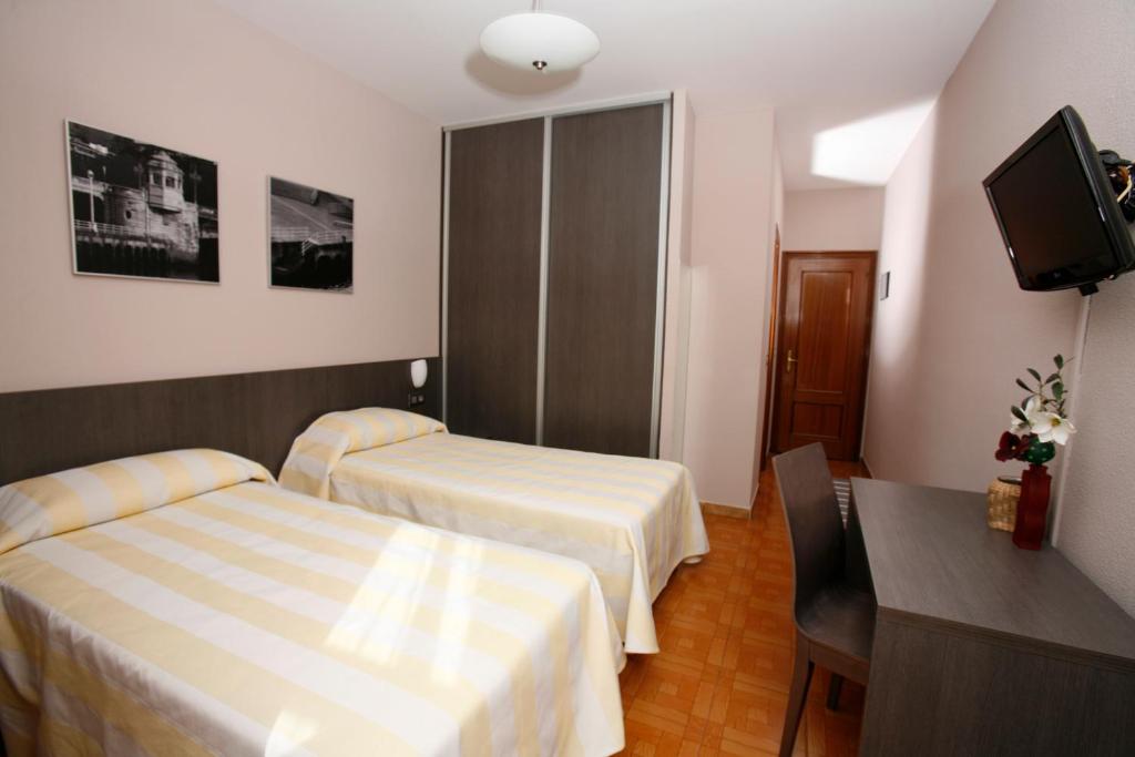 Postel nebo postele na pokoji v ubytování Hotel Ripa