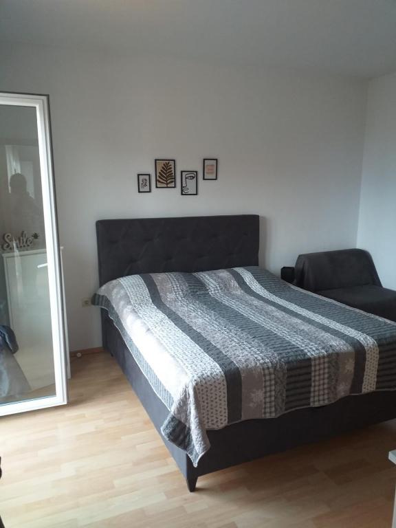 Postel nebo postele na pokoji v ubytování Apartmani Riba