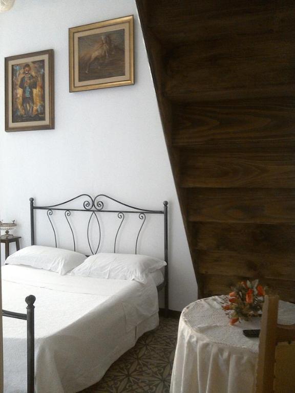 A bed or beds in a room at B&B Palazzo Antonelli