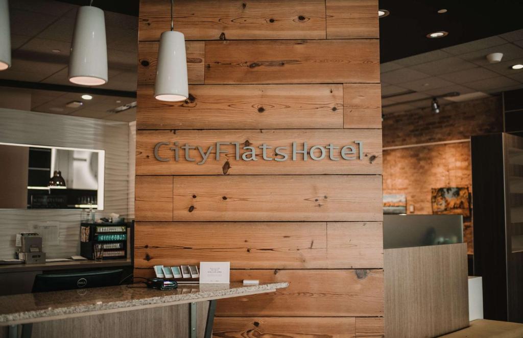 a large wooden wall in a restaurant at CityFlatsHotel - Grand Rapids, Ascend Hotel Collection in Grand Rapids