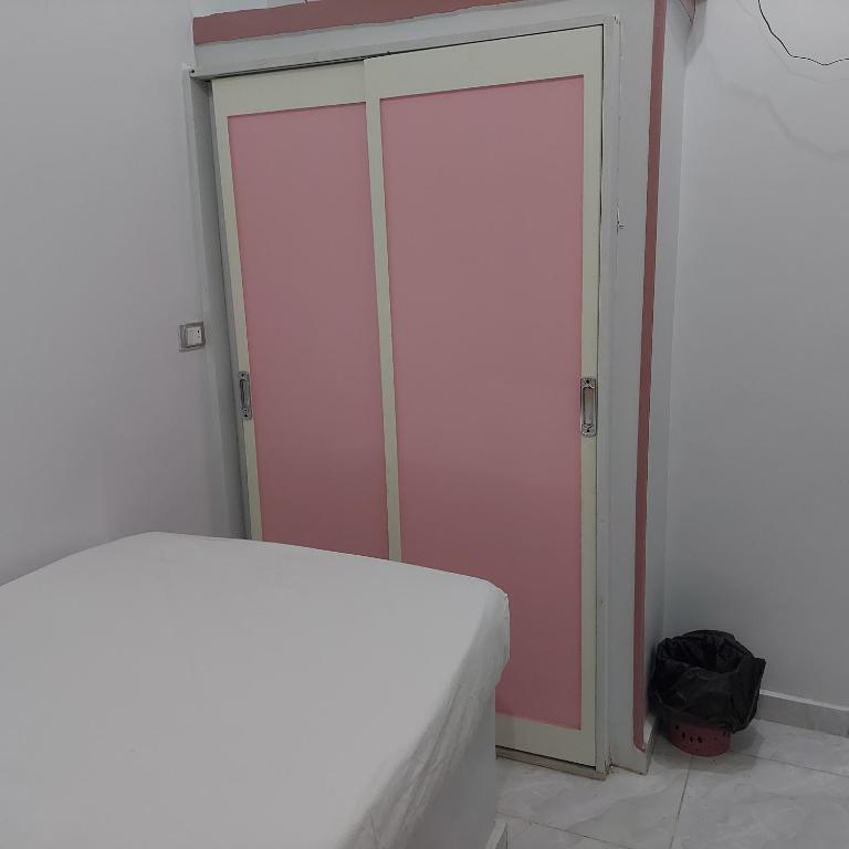 Postel nebo postele na pokoji v ubytování Abo Tamem Guest House