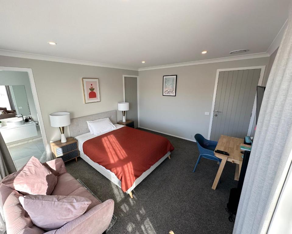 a hotel room with a bed and a couch at Mountain View Room in Wellington