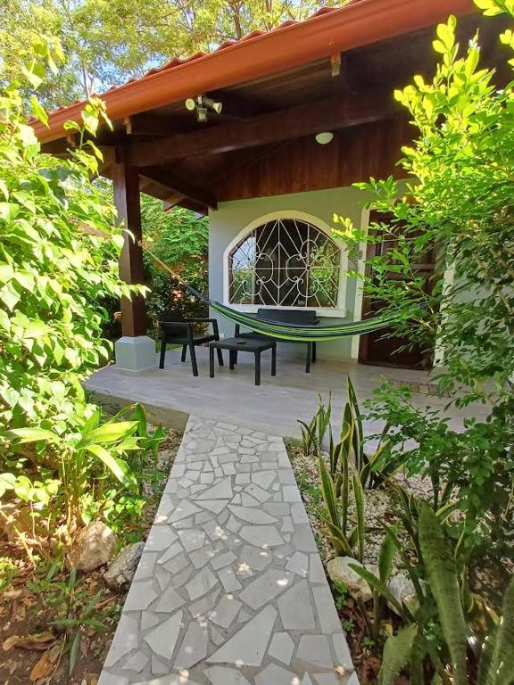 a patio with a bench and a gazebo at Gray House Domenico in Potrero