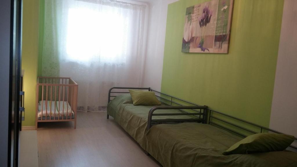 Postel nebo postele na pokoji v ubytování Apartman Nadezda