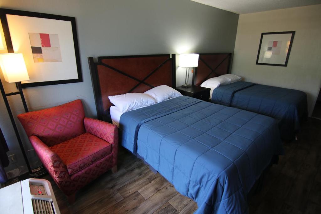 เตียงในห้องที่ 121 Motel Henderson