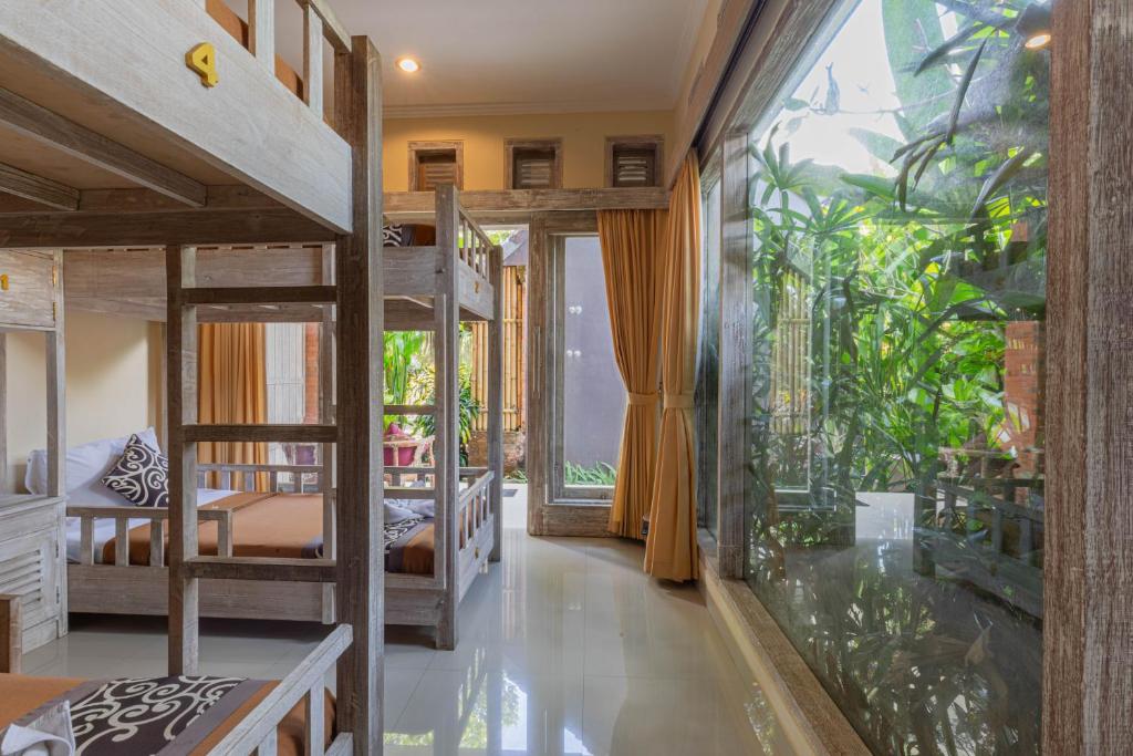 Postel nebo postele na pokoji v ubytování Alam Pracetha Bali Ubud