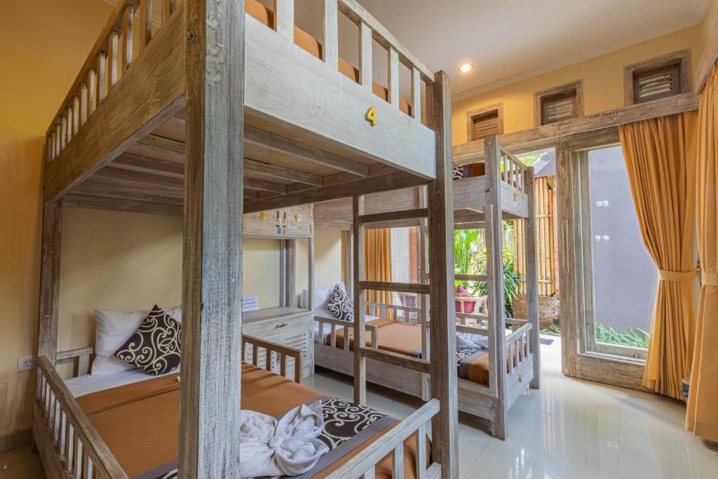 Postel nebo postele na pokoji v ubytování Alam Pracetha Bali Ubud