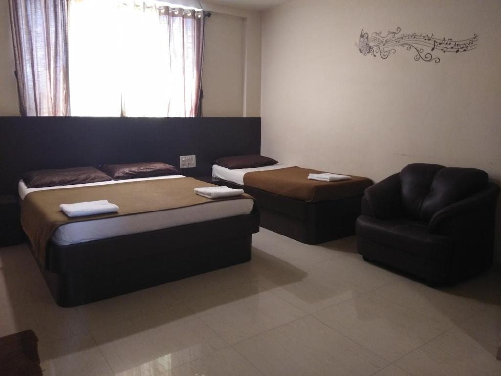 Posezení v ubytování Hotel Krishna Sai Kutir