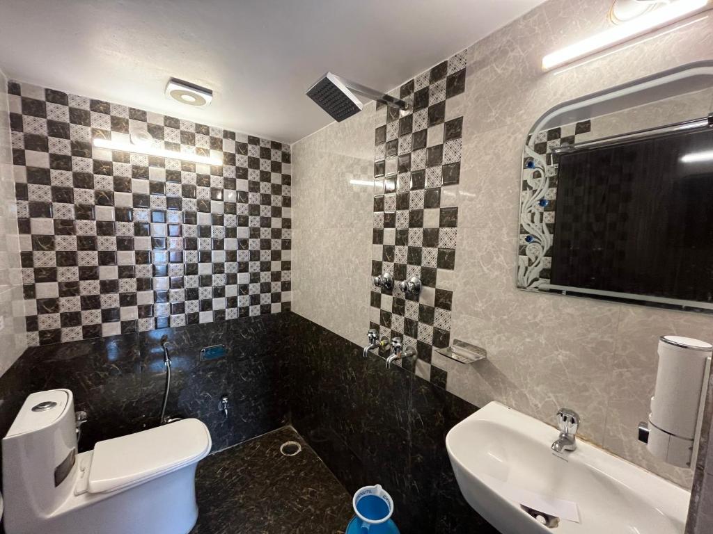 Koupelna v ubytování Hotel Shanti inn