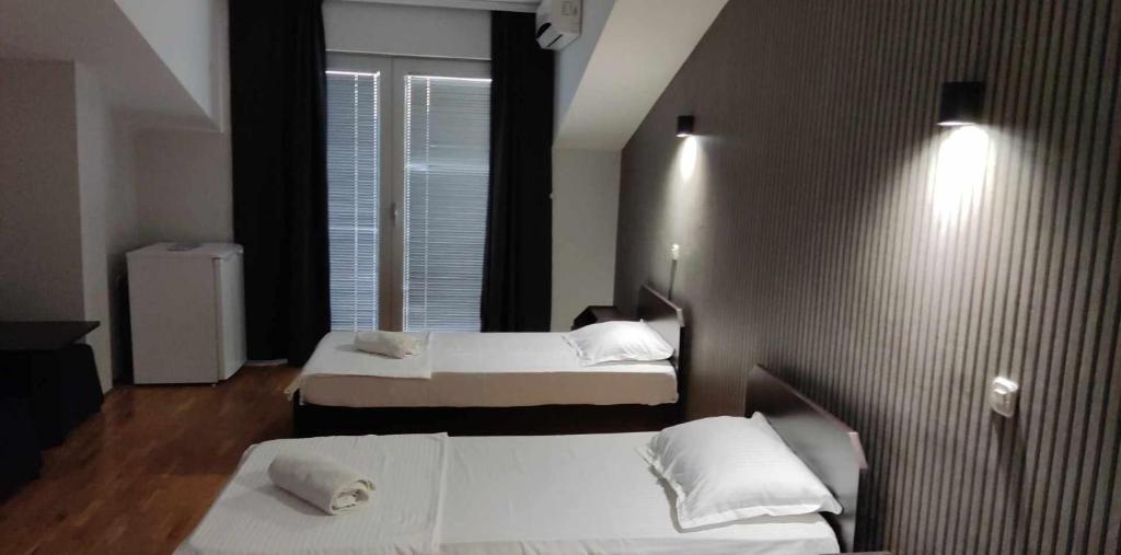 Postel nebo postele na pokoji v ubytování Apartments Philip II