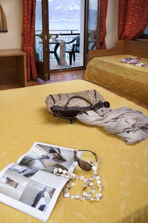 Postel nebo postele na pokoji v ubytování Hotel Merano