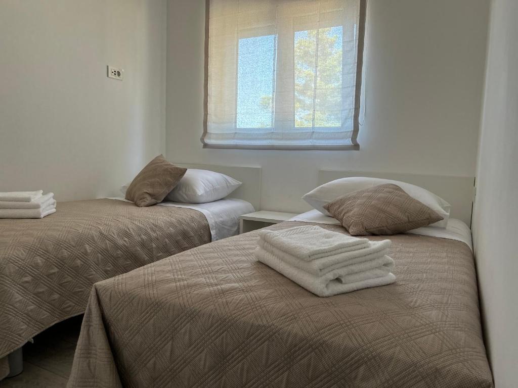 Posteľ alebo postele v izbe v ubytovaní Apartment Rovci 1