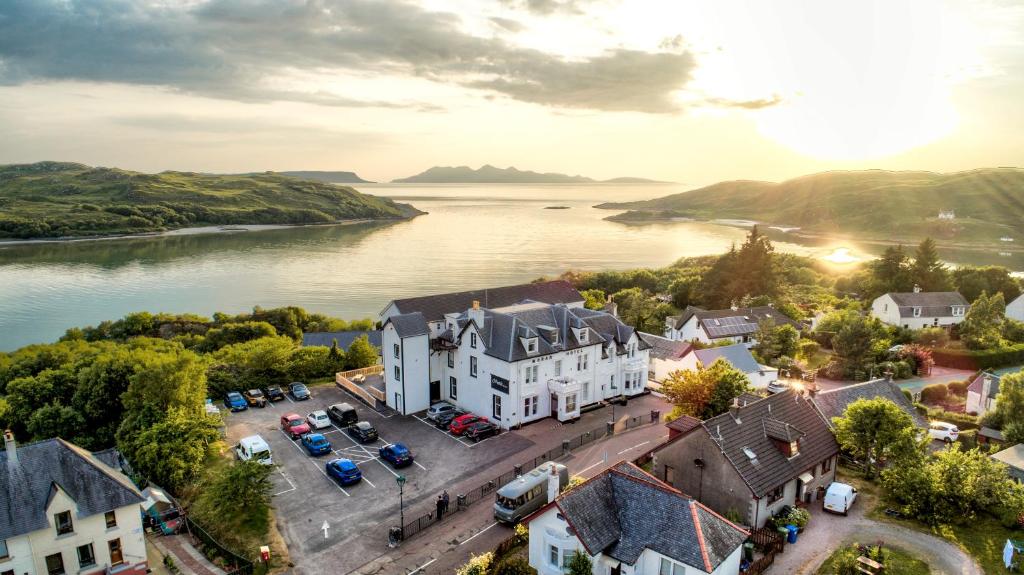 an aerial view of a town next to a river at The Morar Hotel in Morar