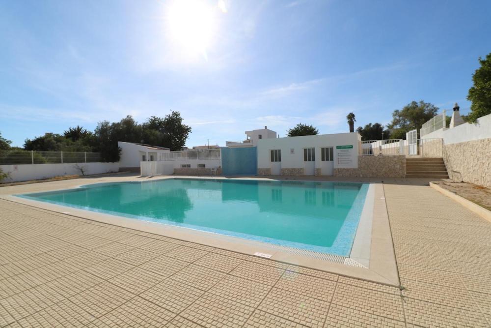 a large swimming pool in the middle of a building at Villa Lídia in Armação de Pêra