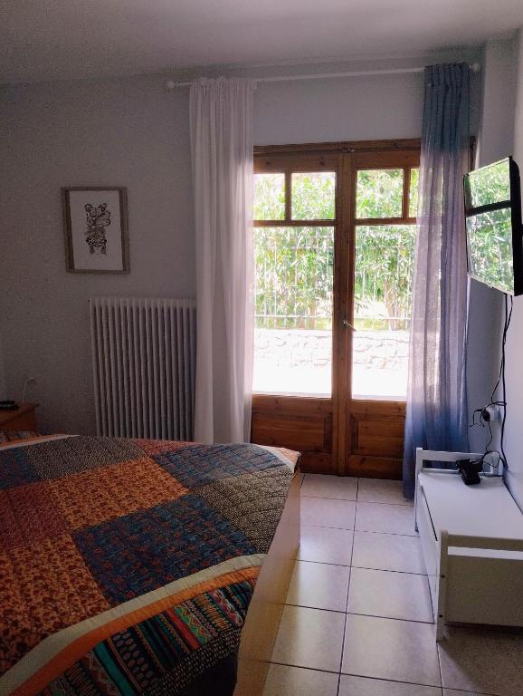 Posteľ alebo postele v izbe v ubytovaní Electra Apartment in Epidaurus