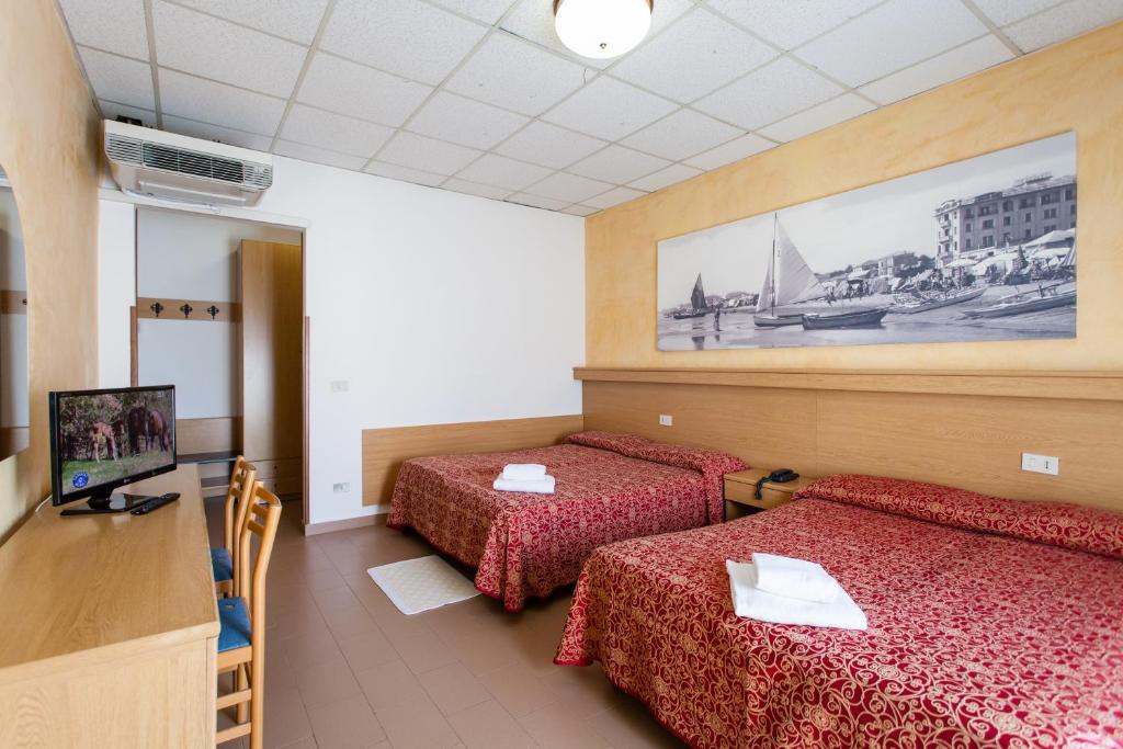 Postel nebo postele na pokoji v ubytování Hotel Al Mare