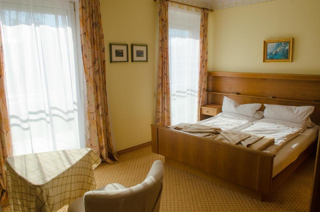 Postel nebo postele na pokoji v ubytování Gästehaus Pension Ria