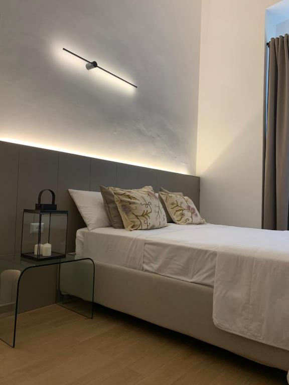 Postel nebo postele na pokoji v ubytování Ritratto Sul Mare