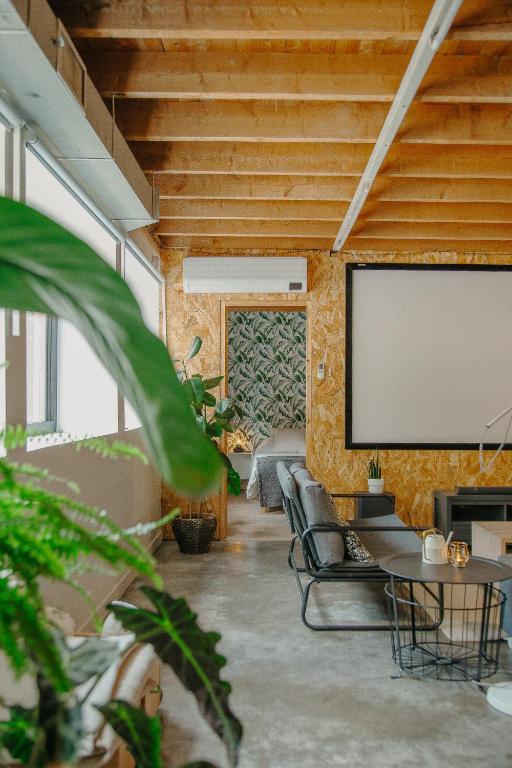 Posedenie v ubytovaní Grand loft avec Jacuzzi et Home Cinema