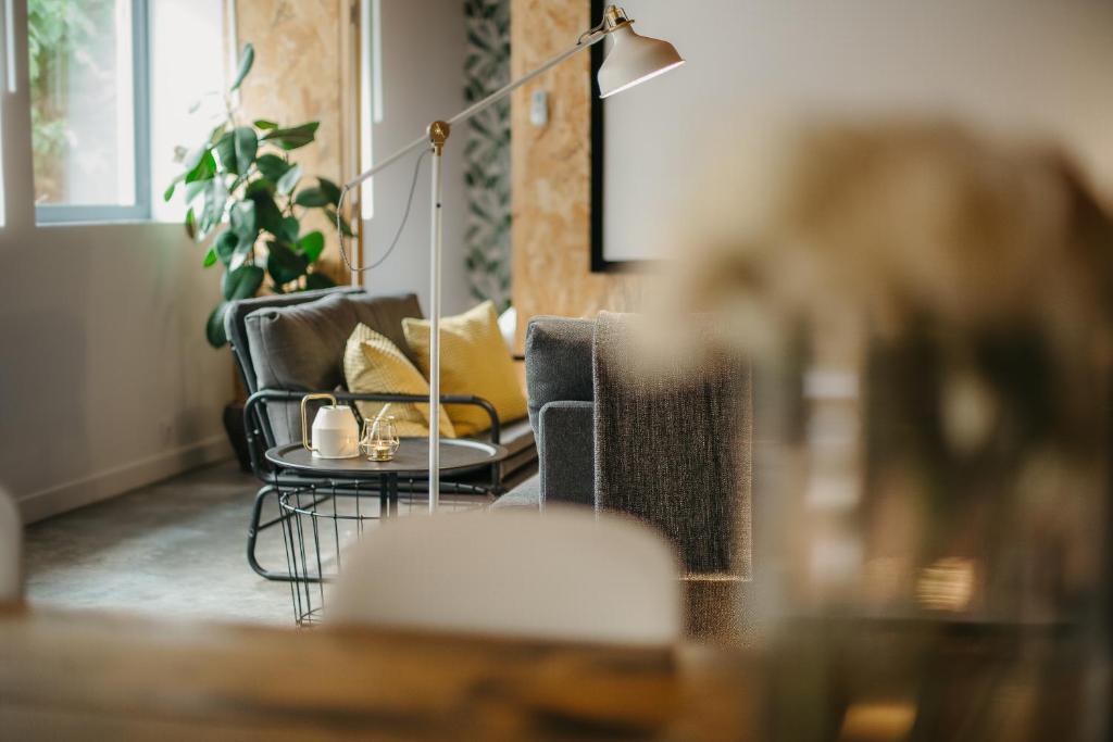Posedenie v ubytovaní Grand loft avec Jacuzzi et Home Cinema