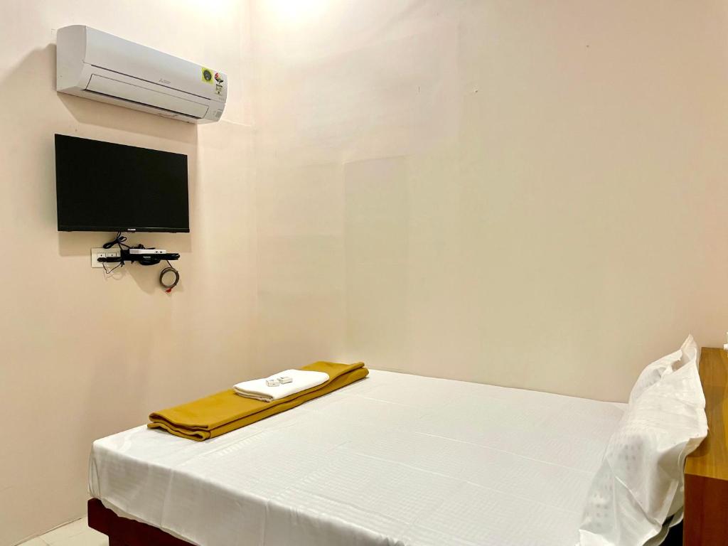 TV a/nebo společenská místnost v ubytování Reach Residency