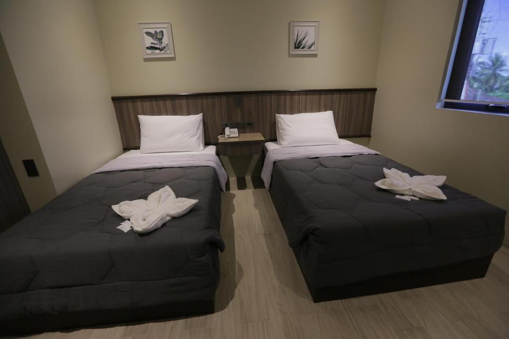 Postel nebo postele na pokoji v ubytování PILAR MARINA INN