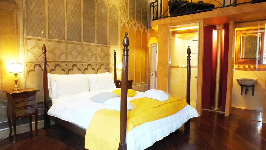 Postel nebo postele na pokoji v ubytování Residenze Gregoriane - Residenza d'Epoca