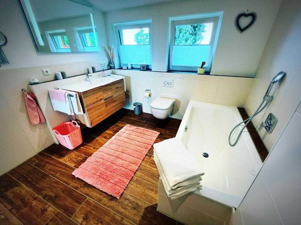 a bathroom with a sink and a toilet at Ferienwohnung Lory mit Schlossblick in Halblech
