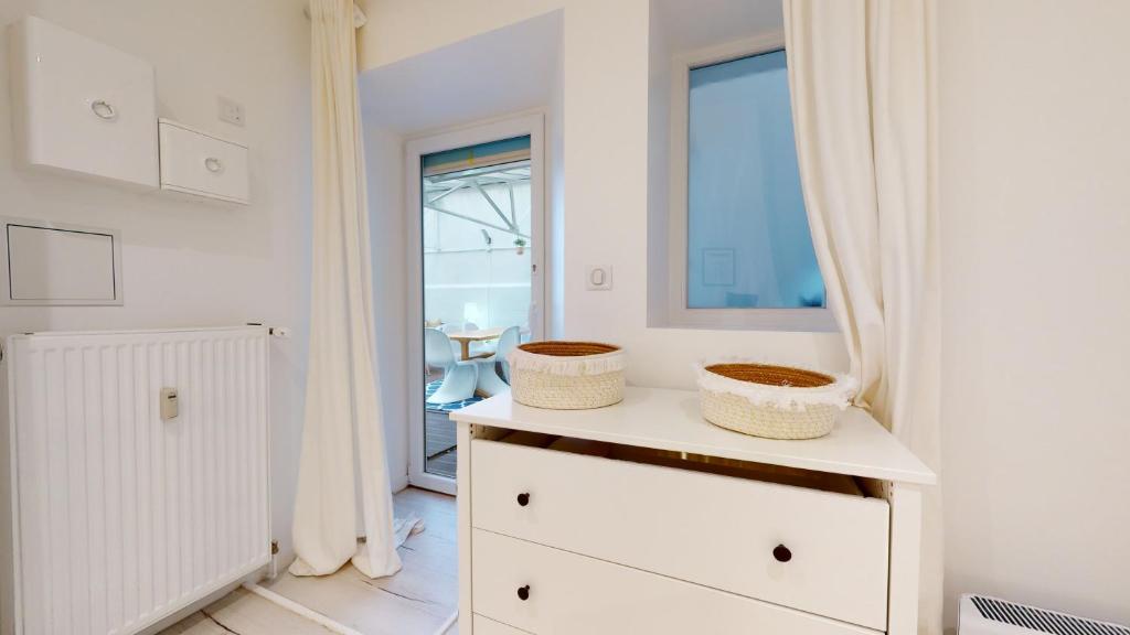 Kúpeľňa v ubytovaní Appartements modernes avec véranda
