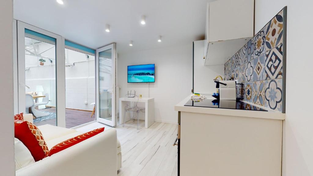 Kuchyňa alebo kuchynka v ubytovaní Appartements modernes avec véranda