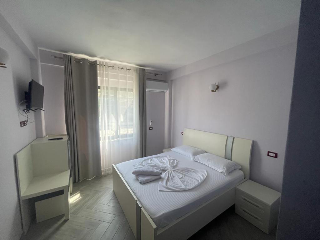 Postel nebo postele na pokoji v ubytování Hotel Ferrara