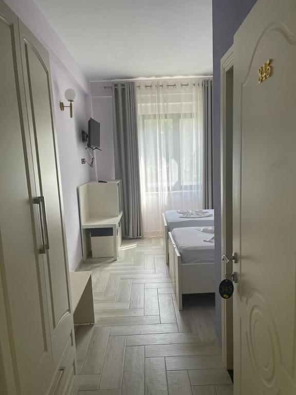 Postel nebo postele na pokoji v ubytování Hotel Ferrara