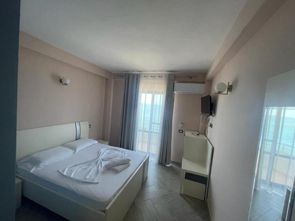 Postel nebo postele na pokoji v ubytování Hotel Ferrara