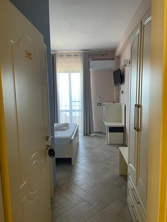 Postel nebo postele na pokoji v ubytování Hotel Ferrara