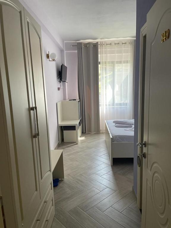 Postel nebo postele na pokoji v ubytování Hotel Ferrara