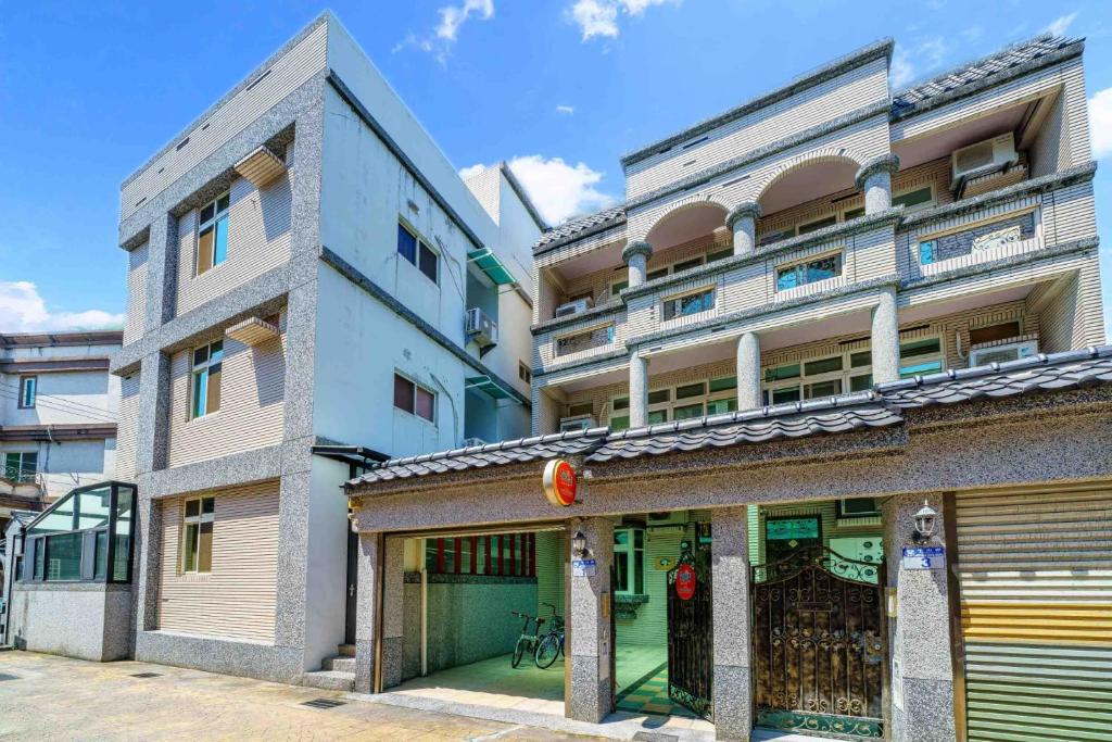 an apartment building with a garage in front of it at 向晴民宿 花蓮市包棟民宿 in Hualien City