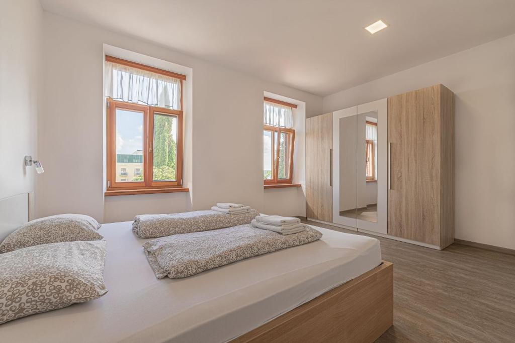 Postel nebo postele na pokoji v ubytování Villa Roma Portorose
