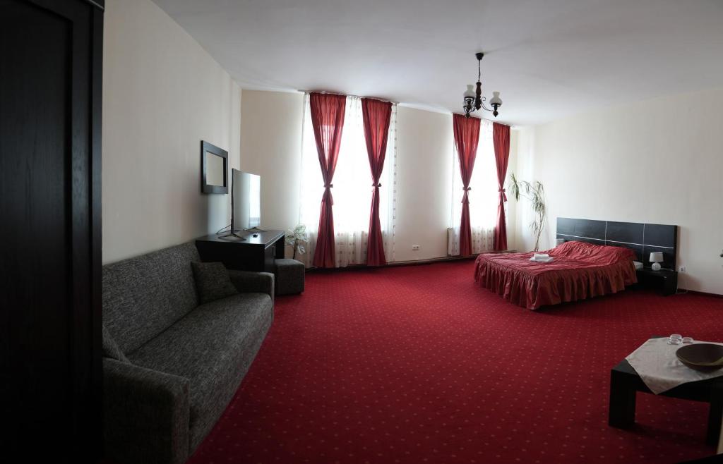 Postel nebo postele na pokoji v ubytování Hotel Rubin***