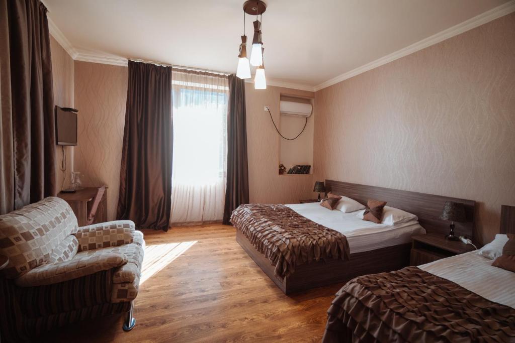 Postel nebo postele na pokoji v ubytování Hotel Metekhara