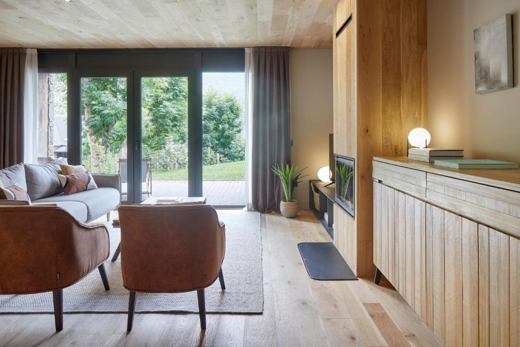 TV a/nebo společenská místnost v ubytování Nheu d'Arties by FeelFree Rentals