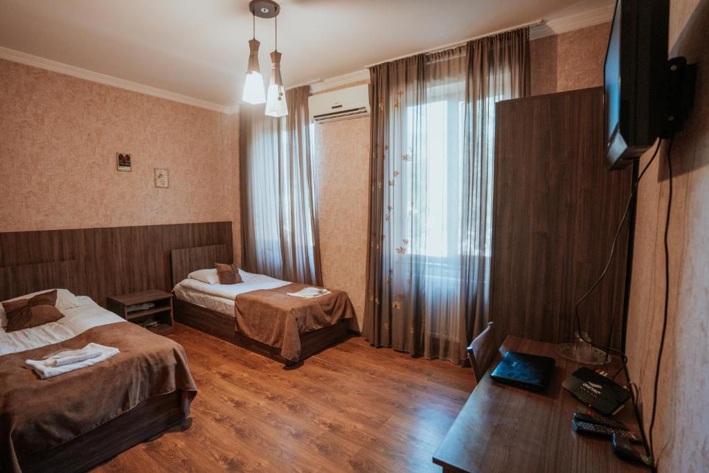Postel nebo postele na pokoji v ubytování Hotel Metekhara