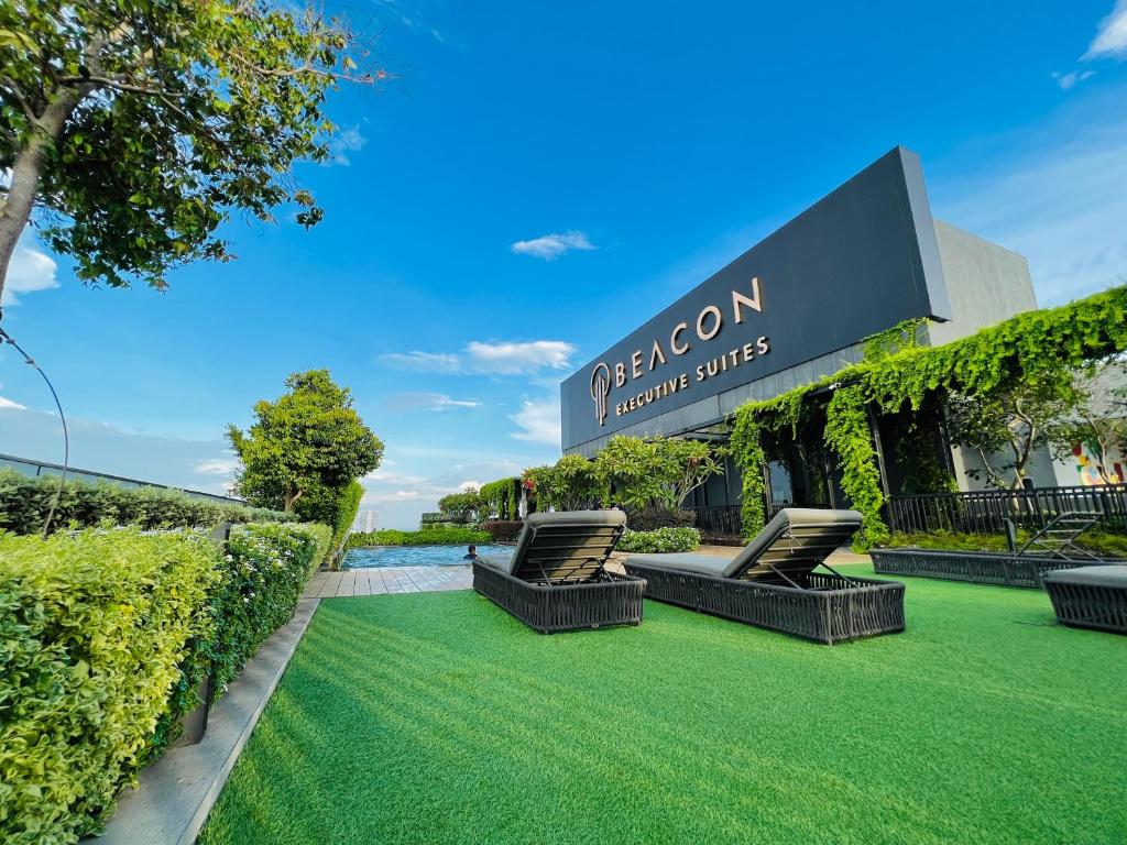 an image of a lawn in front of a building at Beacon Executive Suite #InfinityPool #Penang #GeorgeTown in George Town