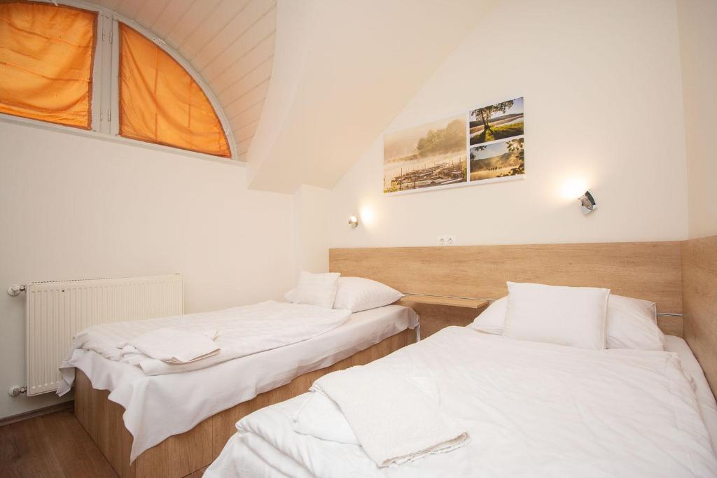 Postel nebo postele na pokoji v ubytování Laterum Motel