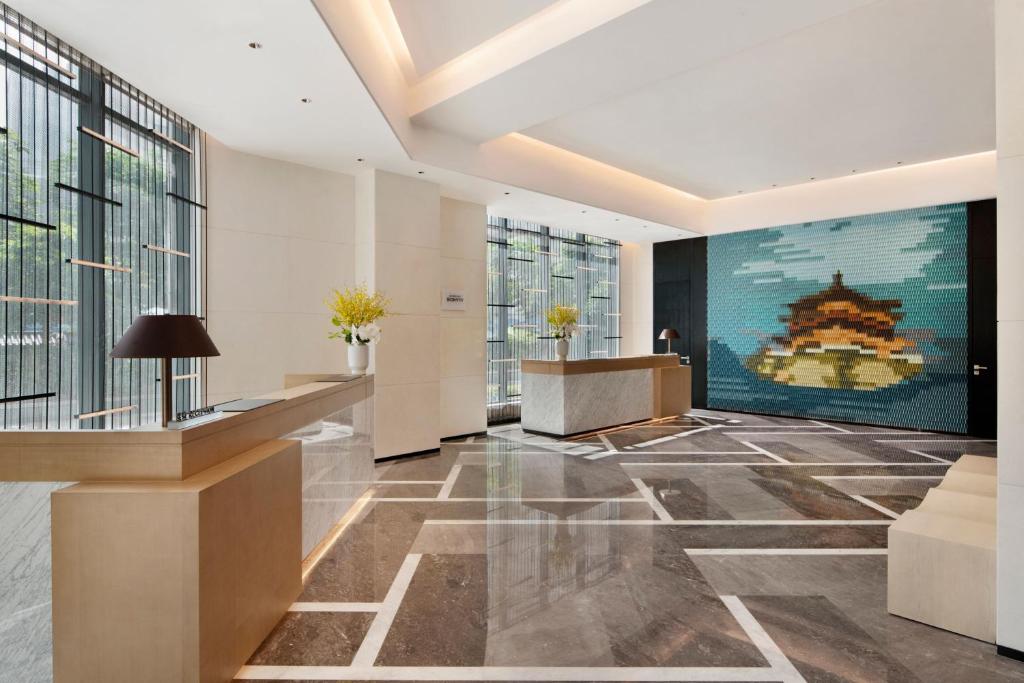 an office lobby with a large painting on the wall at Delta Hotels by Marriott Xi'an in Xi'an