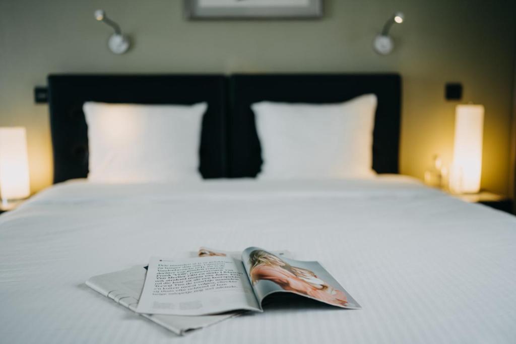 Cama o camas de una habitación en Hotel Astoria Gent