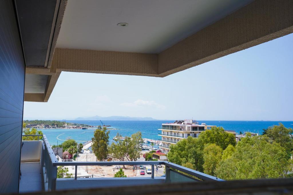 a balcony with a view of the ocean at Endless Blue Studio in Glyfada in Athens